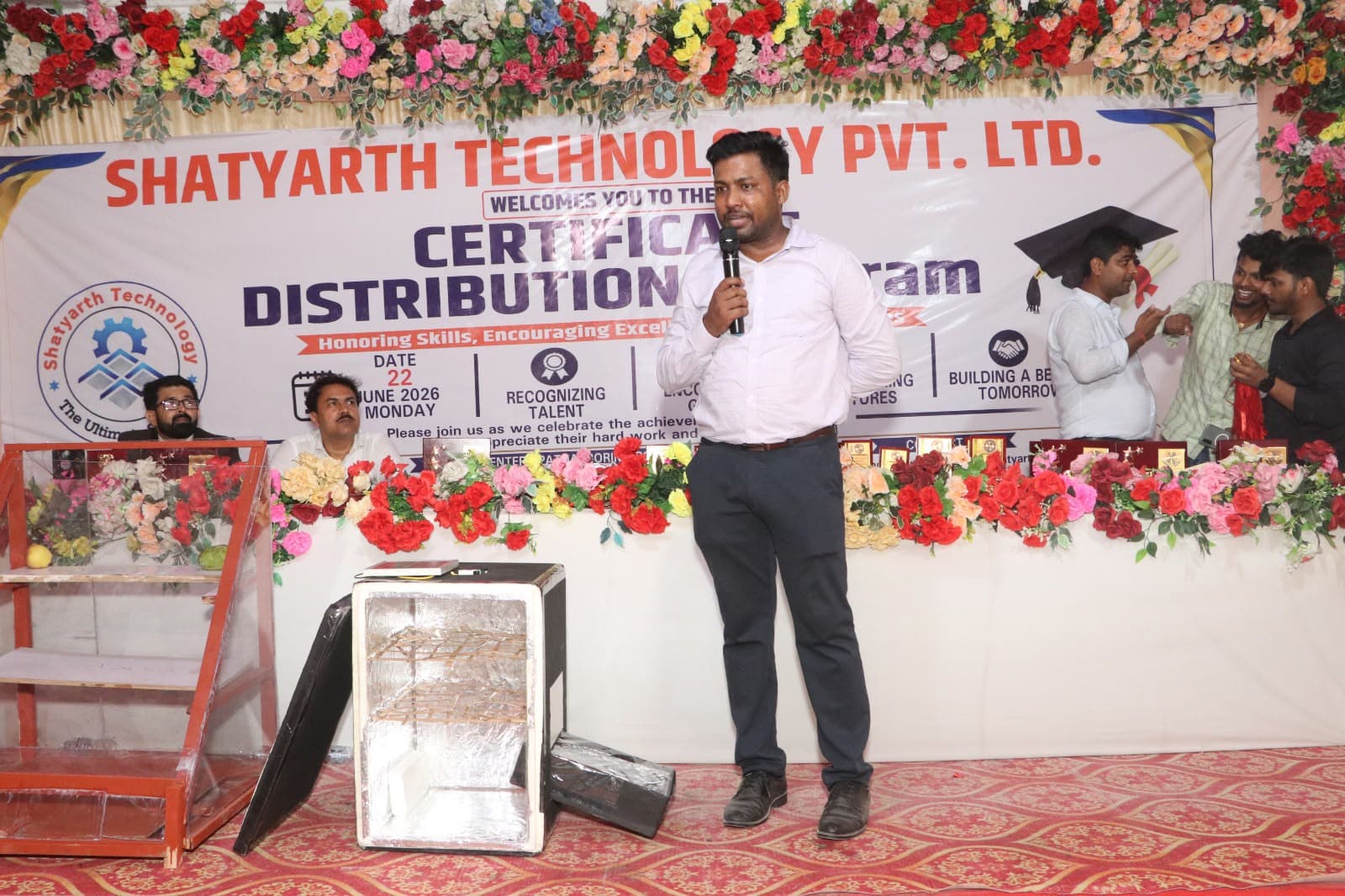 Program coordinator addressing attendees at the Certificate Distribution Program