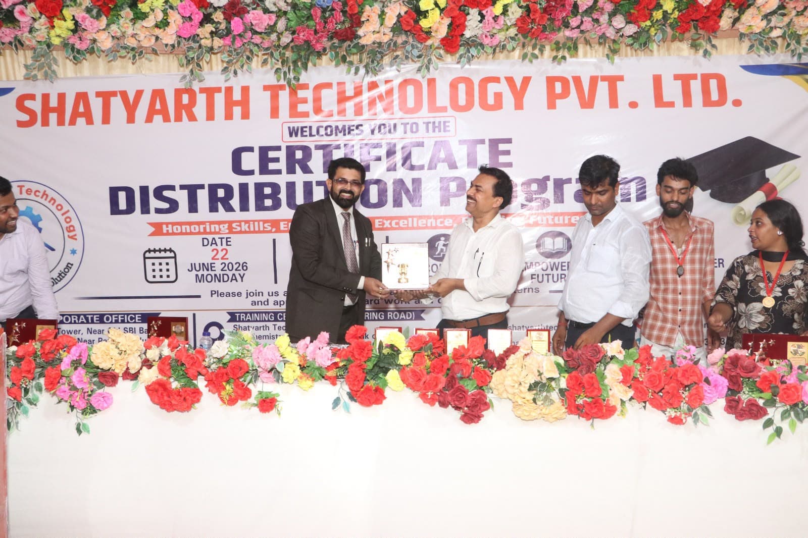Award presentation to a student achiever on stage